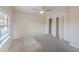 This bedroom features carpet floors, a ceiling fan, and two closets with white doors at 4805 Okeefe St, Orlando, FL 32808