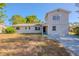 Charming two-story home featuring a cozy entrance and a well-kept lawn at 4805 Okeefe St, Orlando, FL 32808