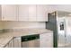 Kitchen featuring stainless steel appliances, gray cabinets, and stone countertops at 4805 Okeefe St, Orlando, FL 32808