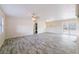 Spacious living room with modern gray wood-look floors, flooded with natural light at 4805 Okeefe St, Orlando, FL 32808