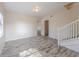 Spacious living area featuring neutral colors and wood-look floors at 4805 Okeefe St, Orlando, FL 32808