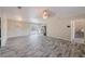 Bright and open living area featuring modern flooring and a view into the kitchen at 4805 Okeefe St, Orlando, FL 32808