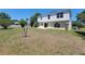 Backyard with an exterior view of the home featuring a patio and green lawn at 502 Eagle Ct, Kissimmee, FL 34759