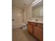 Bathroom featuring a bathtub/shower combo, toilet, and vanity with neutral-colored walls at 502 Eagle Ct, Kissimmee, FL 34759