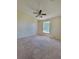 Bedroom featuring a ceiling fan, neutral walls, and a window providing natural light at 502 Eagle Ct, Kissimmee, FL 34759