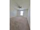 Spacious bedroom featuring a ceiling fan and natural light from the window at 502 Eagle Ct, Kissimmee, FL 34759