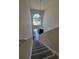 Entryway from above, featuring a stairwell with a large window above the door at 502 Eagle Ct, Kissimmee, FL 34759