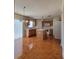 Open kitchen with island, white appliances, and tile flooring at 502 Eagle Ct, Kissimmee, FL 34759