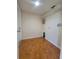 Tiled laundry room with wire rack shelving and hookups for a washer and dryer at 502 Eagle Ct, Kissimmee, FL 34759