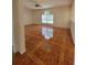 Bright living room features decorative tile floors and a ceiling fan at 502 Eagle Ct, Kissimmee, FL 34759