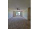 Large living room with a ceiling fan and natural light from a large window at 502 Eagle Ct, Kissimmee, FL 34759