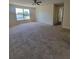 Spacious living room with neutral walls and ample natural light from a large window at 502 Eagle Ct, Kissimmee, FL 34759