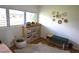 Bedroom featuring a large window and shelving, providing ample storage and natural light at 5384 Barton Dr, Orlando, FL 32807