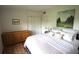 Cozy bedroom with natural wood furniture, soft bedding and decor offering relaxation at 5384 Barton Dr, Orlando, FL 32807
