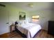 Relaxing bedroom with neutral tones, soft textures, and ample natural light for peaceful comfort at 5384 Barton Dr, Orlando, FL 32807