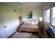 Cozy bedroom with a daybed, a large window, and ample storage at 5384 Barton Dr, Orlando, FL 32807