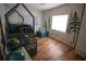 Charming bedroom with whimsical tree mural and a cozy house-frame bed for imaginative play at 5384 Barton Dr, Orlando, FL 32807