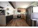 Spacious kitchen with stainless steel appliances and breakfast bar at 5384 Barton Dr, Orlando, FL 32807