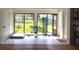 Bright sunroom area with large windows offering a view of the big backyard at 5384 Barton Dr, Orlando, FL 32807