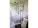 Modern bathroom shower with gray chevron pattern tile, rainfall shower head, and glass enclosure at 5384 Barton Dr, Orlando, FL 32807