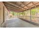Spacious covered back porch with room for entertaining and relaxing at 5500 Riviera Dr, Orlando, FL 32808