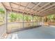 Covered back porch with wooden railings, perfect for outdoor living at 5500 Riviera Dr, Orlando, FL 32808
