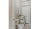 Powder room features a granite vanity, oval mirror, and new toilet at 5500 Riviera Dr, Orlando, FL 32808