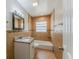 Tiled bathroom featuring a tub, mosaic tile accent, and modern fixtures at 5500 Riviera Dr, Orlando, FL 32808