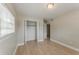 Bright bedroom featuring a closet, light hardwood floors and a window bringing in natural light at 5500 Riviera Dr, Orlando, FL 32808