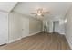 Bright bedroom features wood-look floors, ceiling fan, and an en-suite bathroom and closet at 5500 Riviera Dr, Orlando, FL 32808