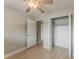 Cozy bedroom with a ceiling fan and a closet at 5500 Riviera Dr, Orlando, FL 32808