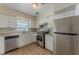 Beautiful kitchen with stainless steel appliances, white cabinets, and modern countertops at 5500 Riviera Dr, Orlando, FL 32808