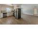Bright, updated kitchen featuring stainless steel appliances and modern countertops at 5500 Riviera Dr, Orlando, FL 32808