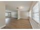 Bright living space featuring modern vinyl floors, fresh paint, and direct access to the main entrance at 5500 Riviera Dr, Orlando, FL 32808