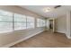 Bright, airy living room featuring large windows, modern flooring, and neutral paint, ready for personalization at 5500 Riviera Dr, Orlando, FL 32808