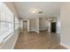 Expansive open-concept living room with neutral walls, modern flooring, and abundant natural light from multiple windows at 5500 Riviera Dr, Orlando, FL 32808