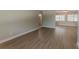 Spacious living area featuring modern flooring and fresh paint, perfect for entertaining and relaxing at 5500 Riviera Dr, Orlando, FL 32808