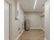 Functional utility room with modern flooring, neutral paint, and a hot water heater at 5500 Riviera Dr, Orlando, FL 32808