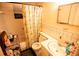 Bathroom features a tub with shower, tiled walls, and a vanity sink, providing essential amenities at 5505 Hernandes Dr # 108, Orlando, FL 32808