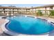 Inviting community pool surrounded by well-kept landscaping, creating a relaxing outdoor space at 5505 Hernandes Dr # 108, Orlando, FL 32808