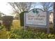 Silver Pines Golf Village Condominium sign with lush greenery, indicating a welcoming community at 5505 Hernandes Dr # 108, Orlando, FL 32808