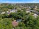 This aerial view of the home shows its pool, large trees, and neighborhood location at 5709 Breskin Dr, Orlando, FL 32839
