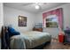 Relaxing bedroom with soft lighting and a window view at 5709 Breskin Dr, Orlando, FL 32839