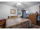 Cozy bedroom with a comfy bed, dresser, and adjacent bathroom at 5709 Breskin Dr, Orlando, FL 32839