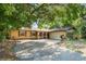 Charming one-story home with a well-maintained lawn and mature trees providing ample shade at 5709 Breskin Dr, Orlando, FL 32839