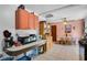 Cozy kitchen with eat-in dining area, peach color cabinets, and stainless steel appliances at 5709 Breskin Dr, Orlando, FL 32839