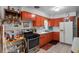 Functional kitchen with peach color cabinets and ample countertop space at 5709 Breskin Dr, Orlando, FL 32839