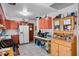 Functional kitchen with peach color cabinets and ample countertop space at 5709 Breskin Dr, Orlando, FL 32839