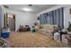 Living room with vintage floral couch, side tables, and basic décor at 5709 Breskin Dr, Orlando, FL 32839