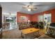Cozy living room featuring comfortable seating, ceiling fan, and view of the pool area at 5709 Breskin Dr, Orlando, FL 32839